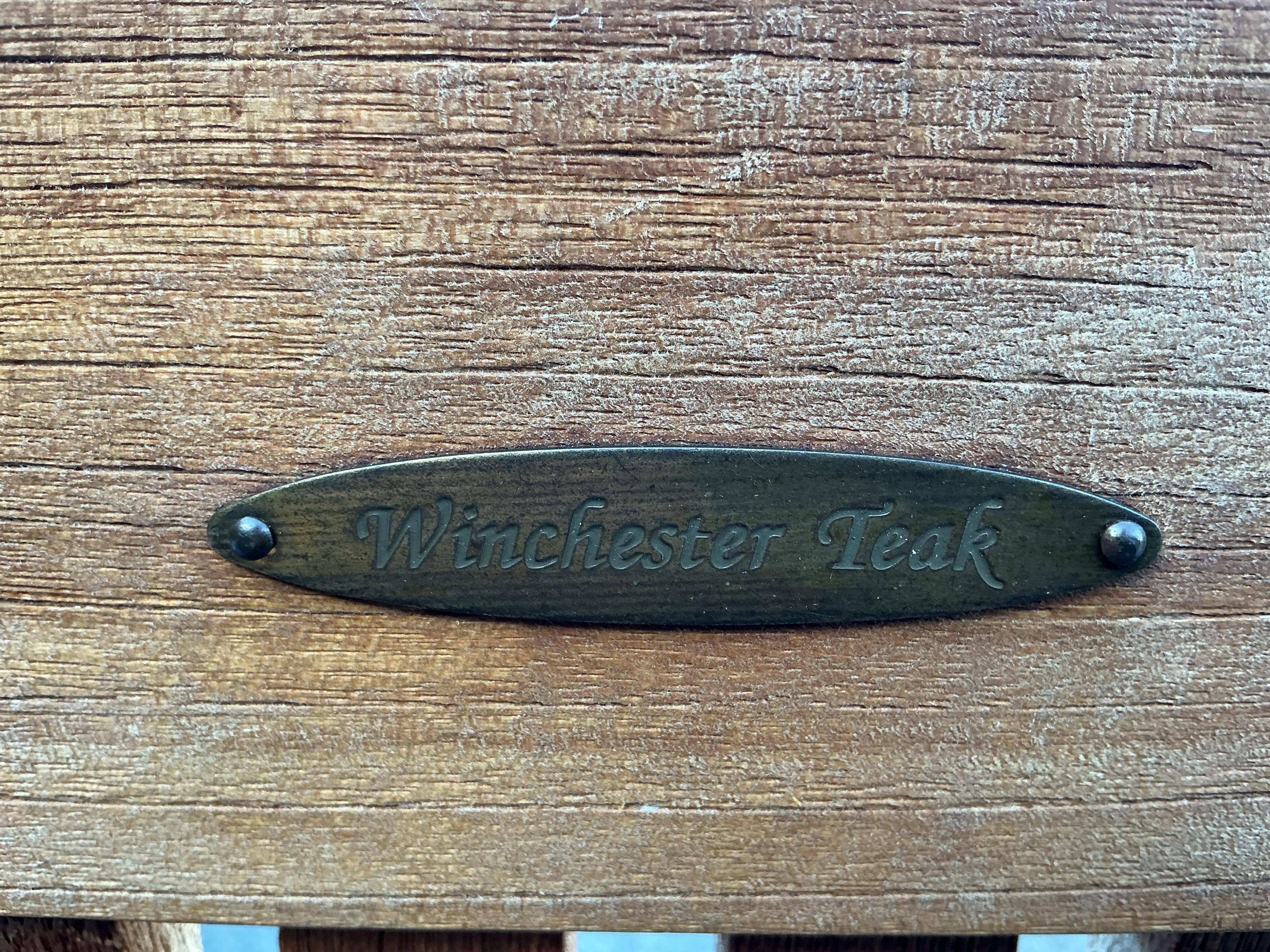 A set of four Winchester teak reclining garden armchairs